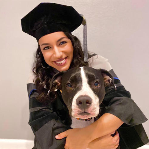 Female grad with dog