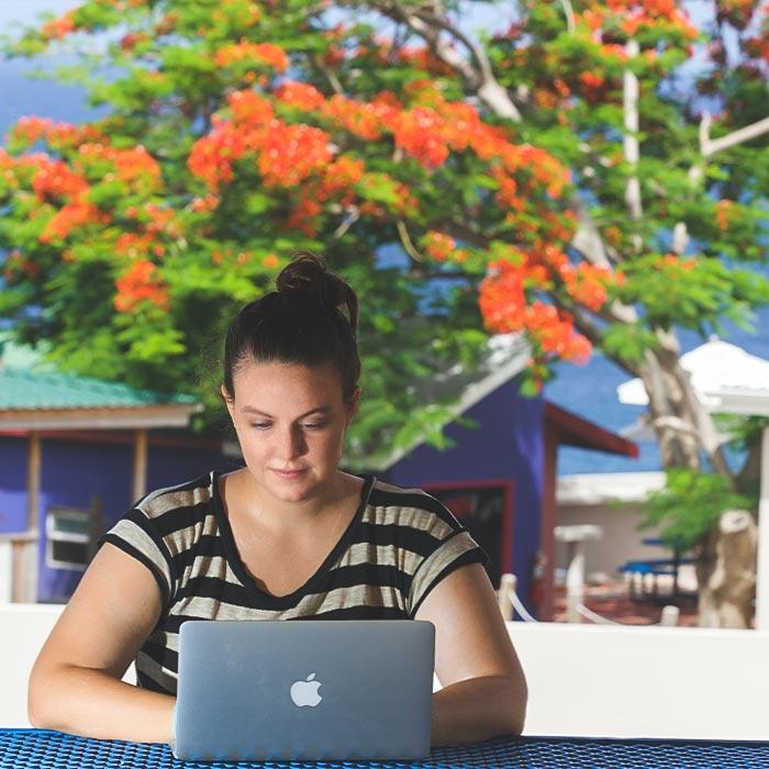 Student studying in a beautiful St. Kitts campus setting