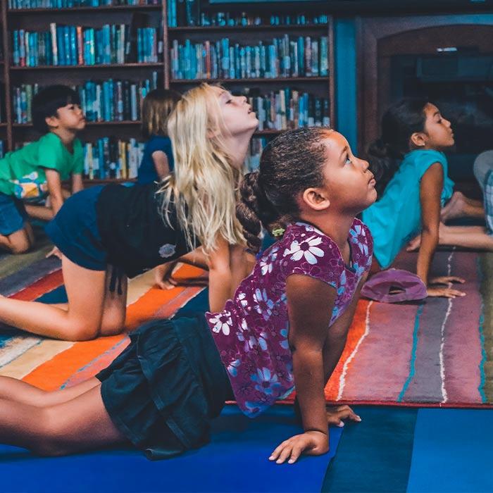 Young students practicing yoga in a class