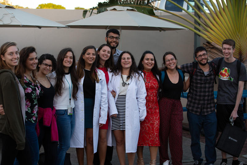 Group photo of students with their white coats